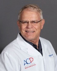 Dr. Hansen headshot photo with white lab coat