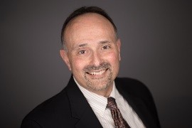 Dr. Tom Viola headshot photo with red tie